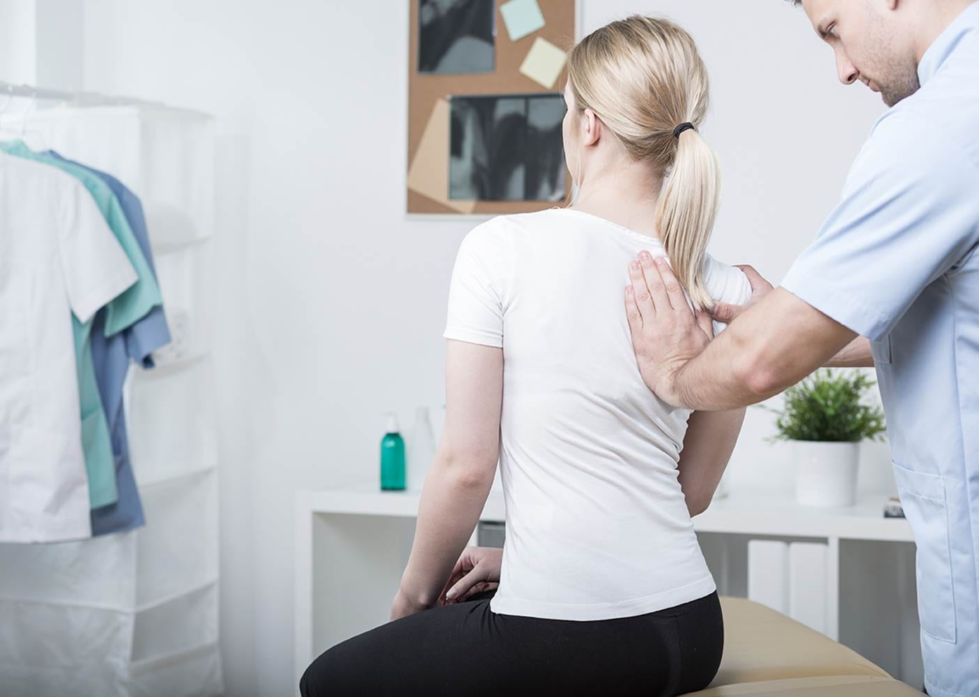 Chiropractic doing spinal mobilisation in physiotherapist's office