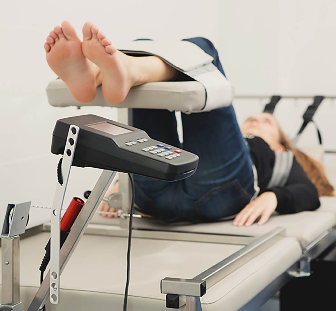 Patient receiving non-surgical spinal decompression therapy at a Dublin physiotherapy clinic for back and neck pain relief.