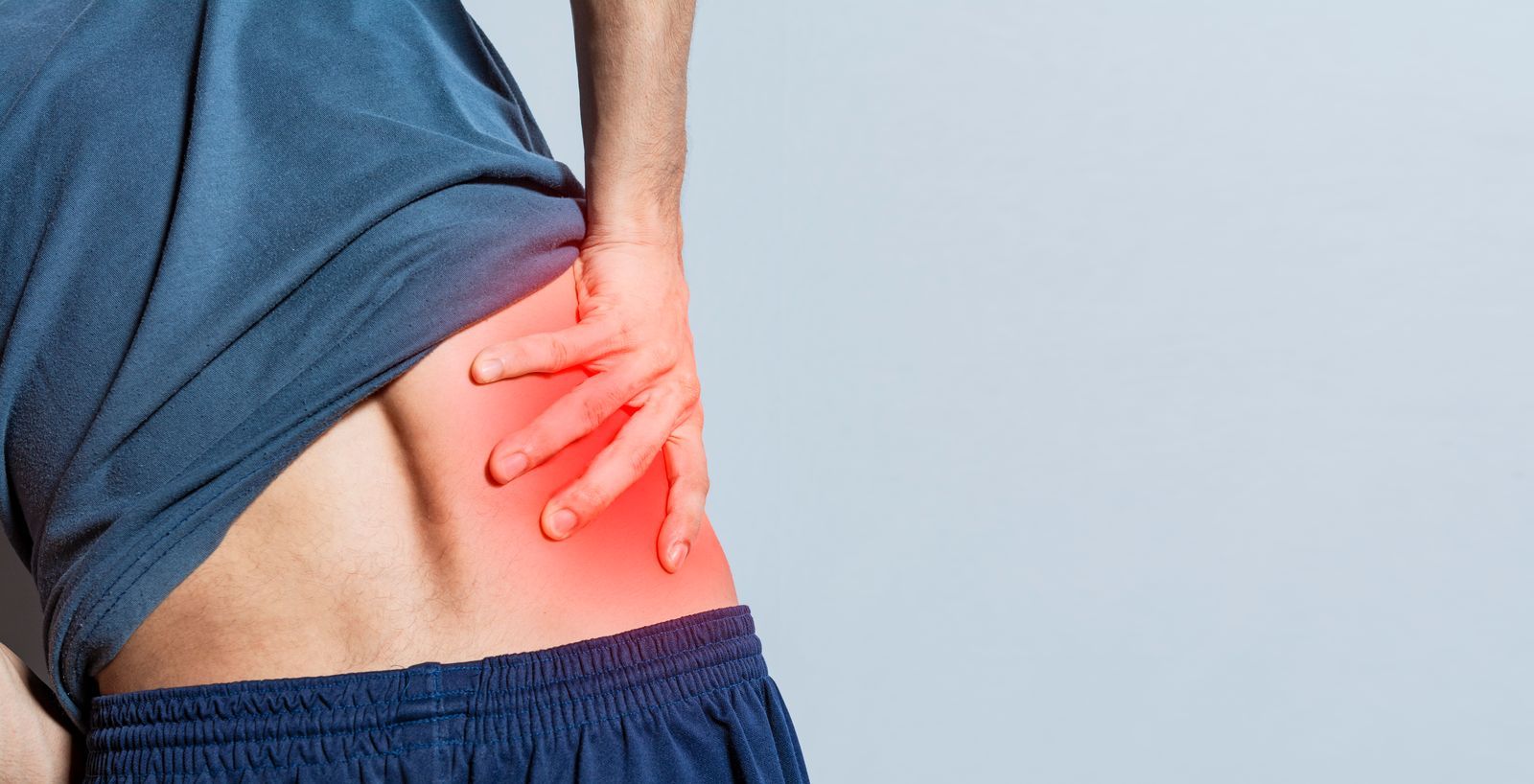 49255486_man-with-spine-and-lower-back-problems-people-with-lower-back-pain-isolated-lumbar-problems-concept-a-sore-man-with-back-pain-unrecognizable-people-with-lower-back-pain