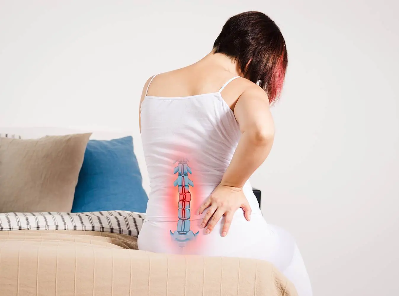 Pain,In,The,Spine,,Woman,With,Backache,At,Home,,Injury Pain in the spine, woman with backache at home, injury in the lower back, photo with highlighted skeleton