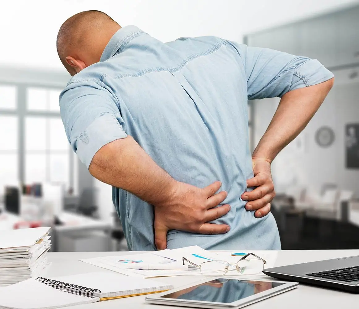 Businessman,With,Back,Pain,An,Office.,Pain,Relief,Concept Businessman with back pain an office. Pain relief concept