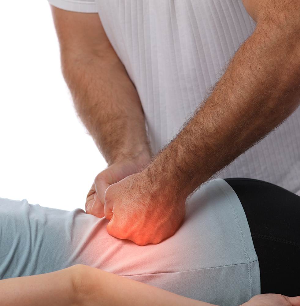 Woman suffering from back pain during Chiropractic treatment. Physiotherapy, Injury Rehabilitation concept
